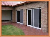 Durlock para cerramientos de oficinas y balcones con aluminio y policarbonato.